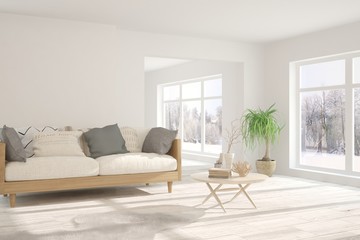 Fototapeta na wymiar Stylish room in white color with sofa and winter landscape in window. Scandinavian interior design. 3D illustration