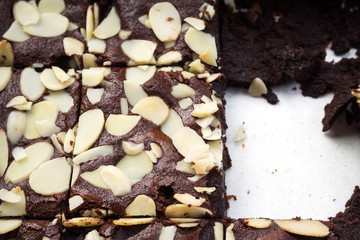 Closeup homemade sliced brownies in baking tray. With copy space.