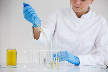 Scientist extracts pharmaceutical cbd oil in a laboratory