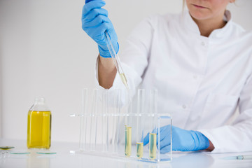 Scientist extracts pharmaceutical cbd oil in a laboratory