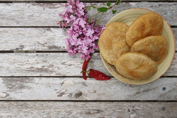 A deep fried poori or kachauri with sicy lenti filling.