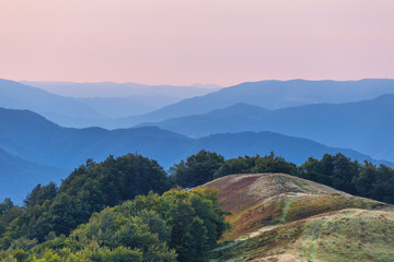 early morning mountain landscape, mount top in the mist