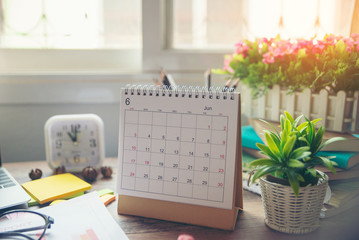 Desktop Calendar 2019 and clock place on wooden office desk.Calender for Planner timetable,agenda appointment,organization,management on table.Calendar Background Concept.