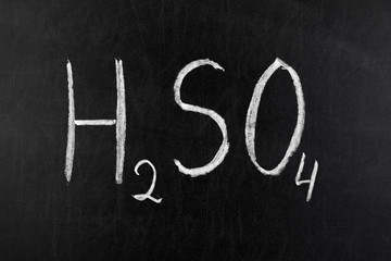 Sulfuric acid on chalkboard blackboard
