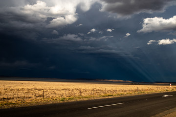 Obraz na płótnie Canvas Thunderstorm with Sun Rays through Clouds