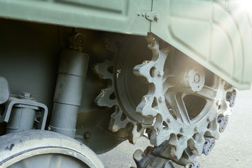 Military industry. View of the front part of the green caterpillar of the tank.