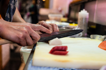 preparing and cooking sushi satshimi for japanese food