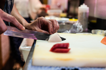 preparing and cooking sushi satshimi for japanese food