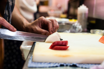 Obraz premium preparing and cooking sushi satshimi for japanese food
