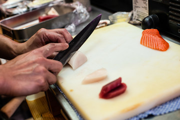 preparing and cooking sushi satshimi for japanese food