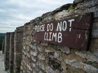 Do Not Climb warning sign on ruined wall, Ancient Mayan Archaeological Site, San Jose Succotz, Cayo District, Belize