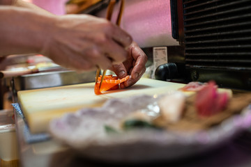 preparing and cooking sushi satshimi for japanese food
