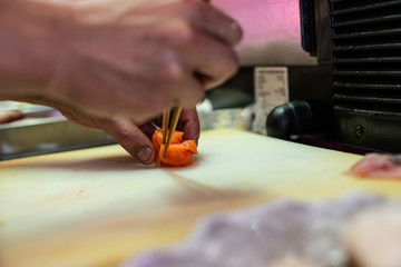 Obraz na płótnie Canvas preparing and cooking sushi satshimi for japanese food