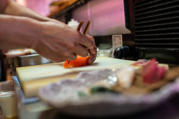 preparing and cooking sushi satshimi for japanese food