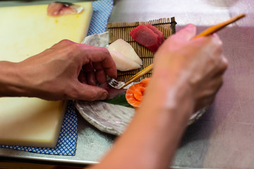 preparing and cooking sushi satshimi for japanese food