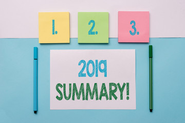 Text sign showing 2019 Summary. Business photo text summarizing past year events main actions or good shows Note papers and stationary placed sideways on top of softhued backdrop