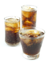 Cola with ice in 3 glass isolated on white background