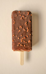 Chocolate ice cream bar, with almonds on the white isolated background. Ice cream bar,summer food concept. Cold yummy ice cream