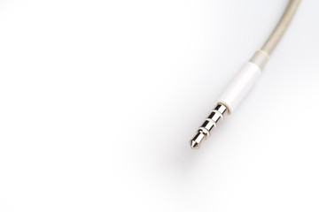 Isolated white aux cable on white background