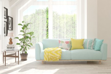 Stylish room in white color with sofa and summer landscape in window. Scandinavian interior design. 3D illustration