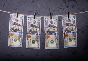 Money Laundering. Money Laundering US dollars hung out to dry. 100 dollar bills hanging on...