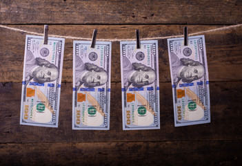 Money Laundering. Money Laundering US dollars hung out to dry. 100 dollar bills hanging on clotheslines