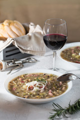 Rustic bean and farro soup with pancetta, onion, rosemary and celery. Italian food.