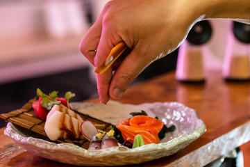 preparing delicious japanese food with fish