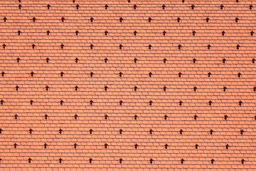 Fragment of a tiled roof of an old building in Vienna.  Design Of A Red Roof Of Made Of Shingles. Selective focus. Copy space.