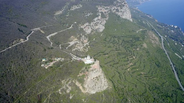Aerial of remote Church on top of a cliff
