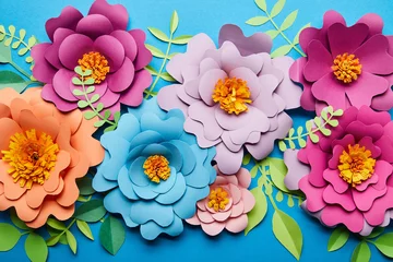 Foto op Canvas top view of bright colorful paper cut flowers with green leaves on blue background © LIGHTFIELD STUDIOS