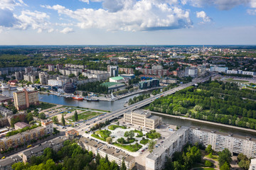 Fototapeta na wymiar Aerial: The new fountain on the background of Kaliningrad cityscape