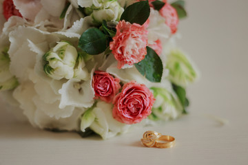Beautiful modern wedding bouquet on a white table. Wedding attributes. No people