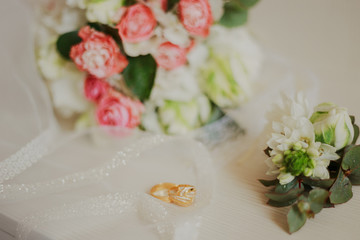 Beautiful modern wedding bouquet on a white table. Wedding attributes. No people