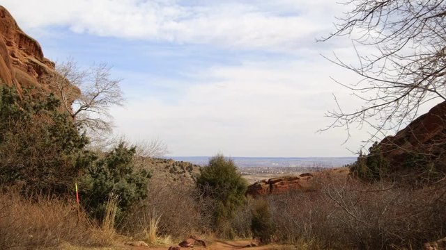 Red Rocs desert scenery with city off in distance