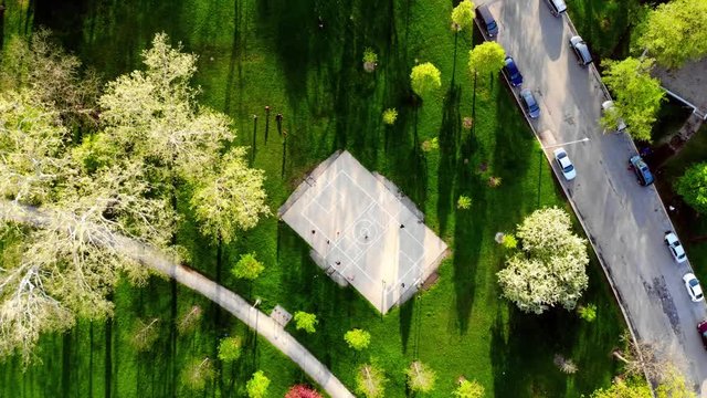 Aerial drone basketball court in park on summer day