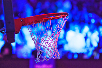 Fototapeta na wymiar basketball hoop in red neon lights - game day