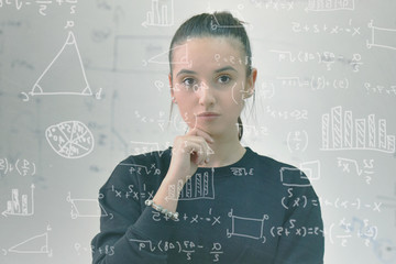 Young female student in math class overwhelmed by the math formula. Pressure, Education, Success...
