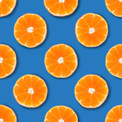 Seamless pattern made of tangerine on a blue background