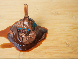 ice cream is melting on Wood  background