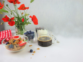 Breakfast served with coffee, cereals and fruits.