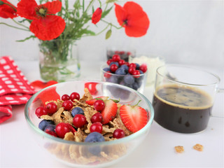 Breakfast served with coffee, cereals and fruits.