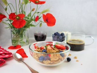 Breakfast served with coffee, cereals and fruits.