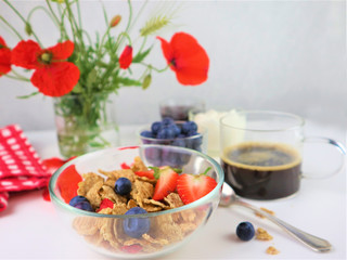 Breakfast served with coffee, cereals and fruits.