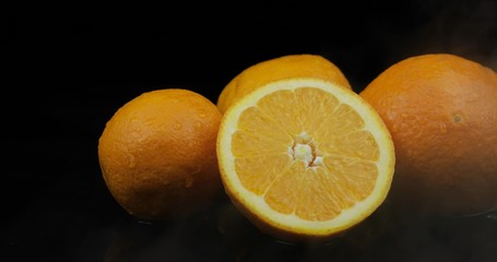 Fototapeta na wymiar Tropical fruit orange on black background