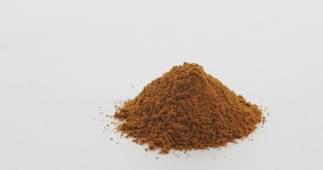 Red pepper powder. Macro shot against a white background