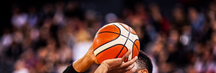 basketball player shooting three pointer