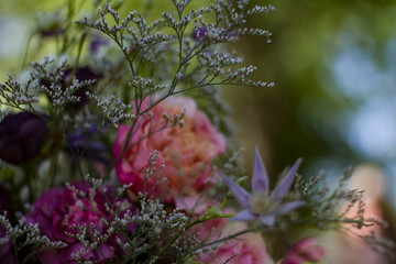 a bouquet of red white flowers of red and pink roses