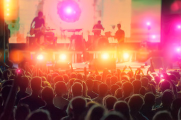 rock musicians and fans during the performance.