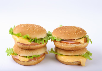 Isolation of burger with cheese and sausages. Close up